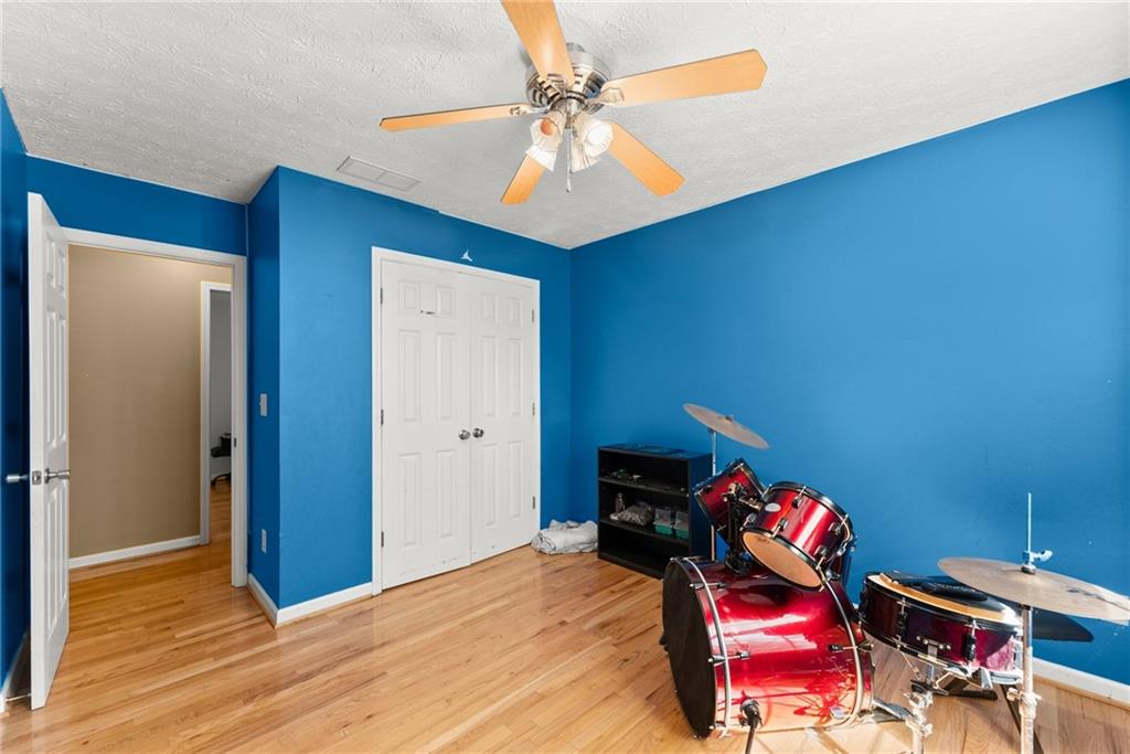 7540 County Line Road Lula, GA 30554 - Photo 30 of 64 a bedroom with furniture and a wooden floor