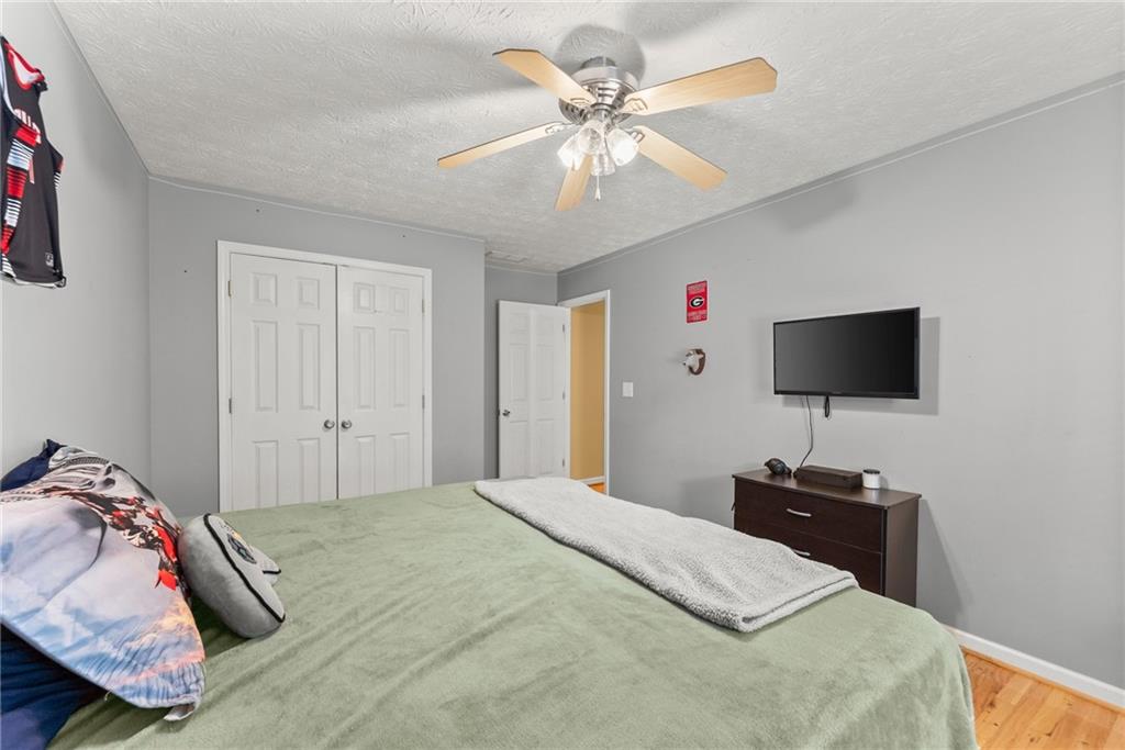 7540 County Line Road Lula, GA 30554 - Photo 32 of 64 a bedroom with a bed and a flat screen tv