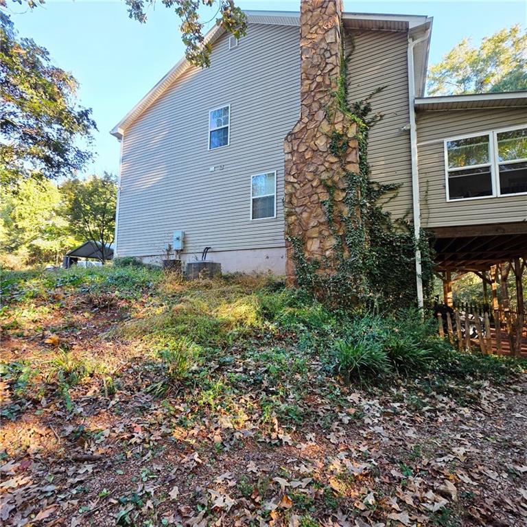 7540 County Line Road Lula, GA 30554 - Photo 42 of 64 a backyard of a house with lots of green space