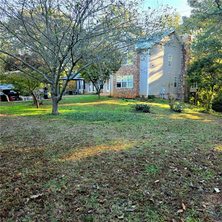 7540 County Line Road Lula, GA 30554 - Photo 9 of 64 a view of a house with a yard