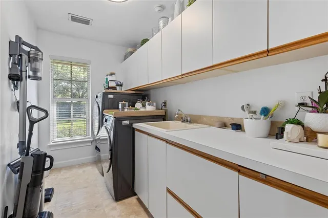a picture of a bathroom with a white wall