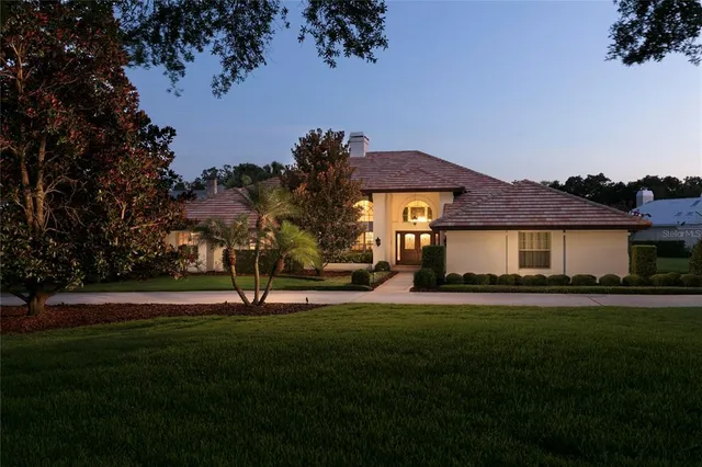 a view of a swimming pool with outdoor seating