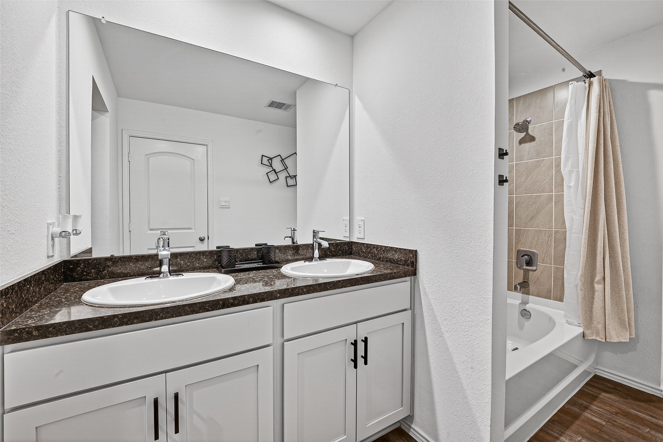 24318 Pebble Crescent Ln Spring Spring, TX 77373 - Photo 21 of 30 Relax in the primary en suite bath smartly accented with dual sinks, tub/shower combo and large walk in closet.