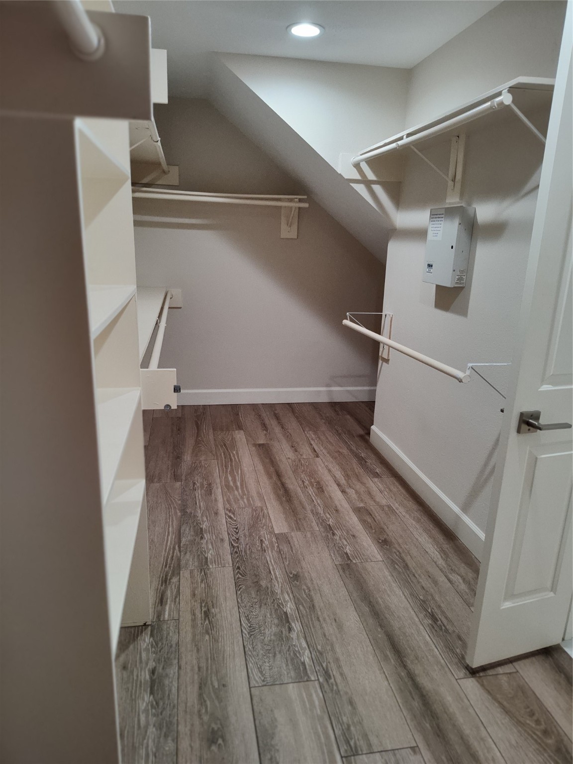 4127 North Nolan Place Pearland, TX 77584 - Photo 15 of 25 a view of walk in closet with wooden floor