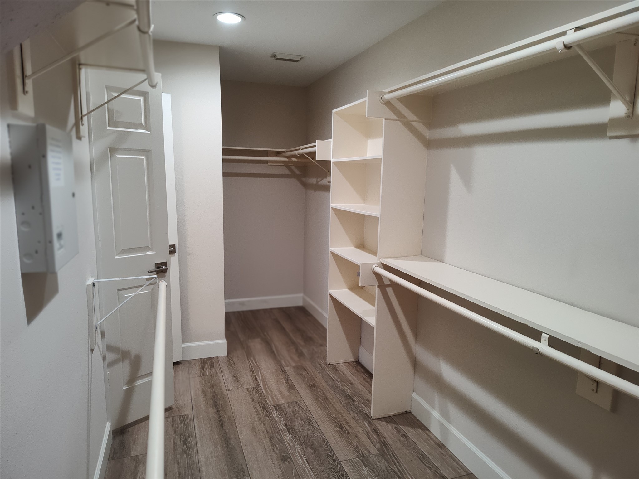 4127 North Nolan Place Pearland, TX 77584 - Photo 16 of 25 a view of walk in closet with wooden floor