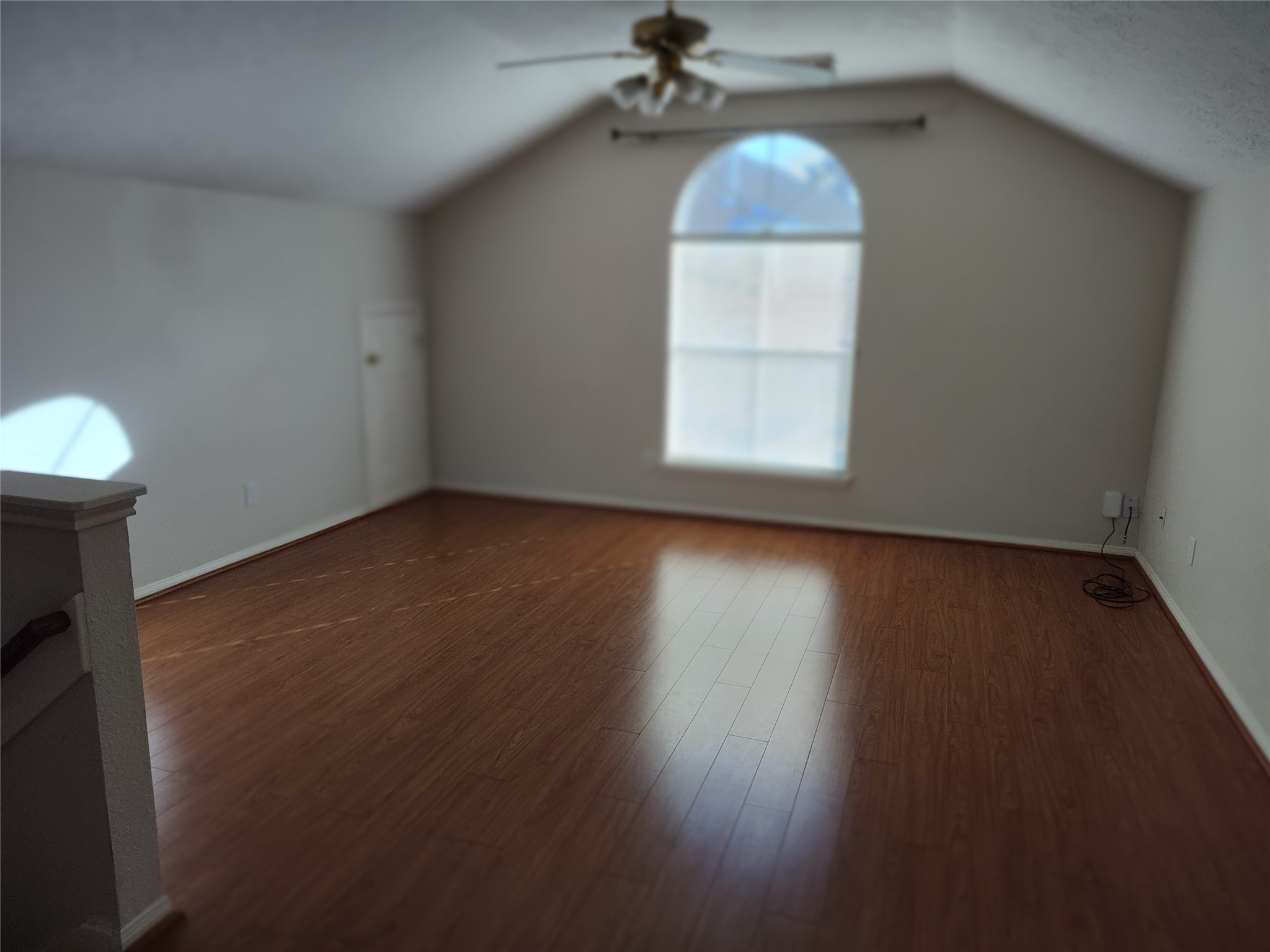 4127 North Nolan Place Pearland, TX 77584 - Photo 17 of 25 an empty room with wooden floor and windows