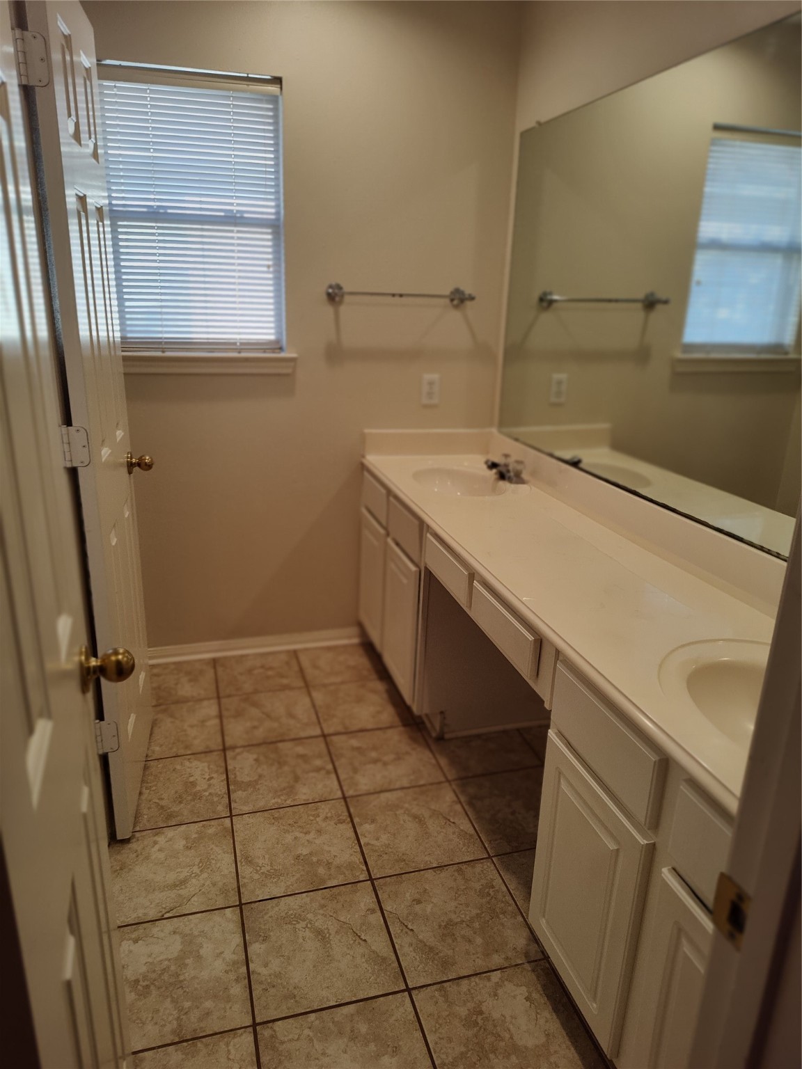 4127 North Nolan Place Pearland, TX 77584 - Photo 21 of 25 a bathroom with a sink a vanity and a mirror