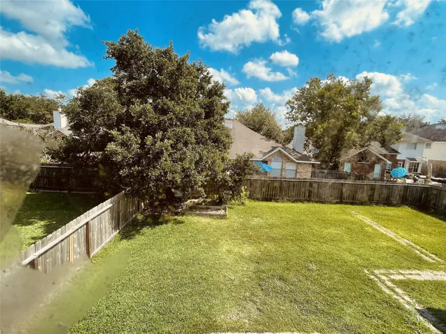 a swimming pool with trees in the background