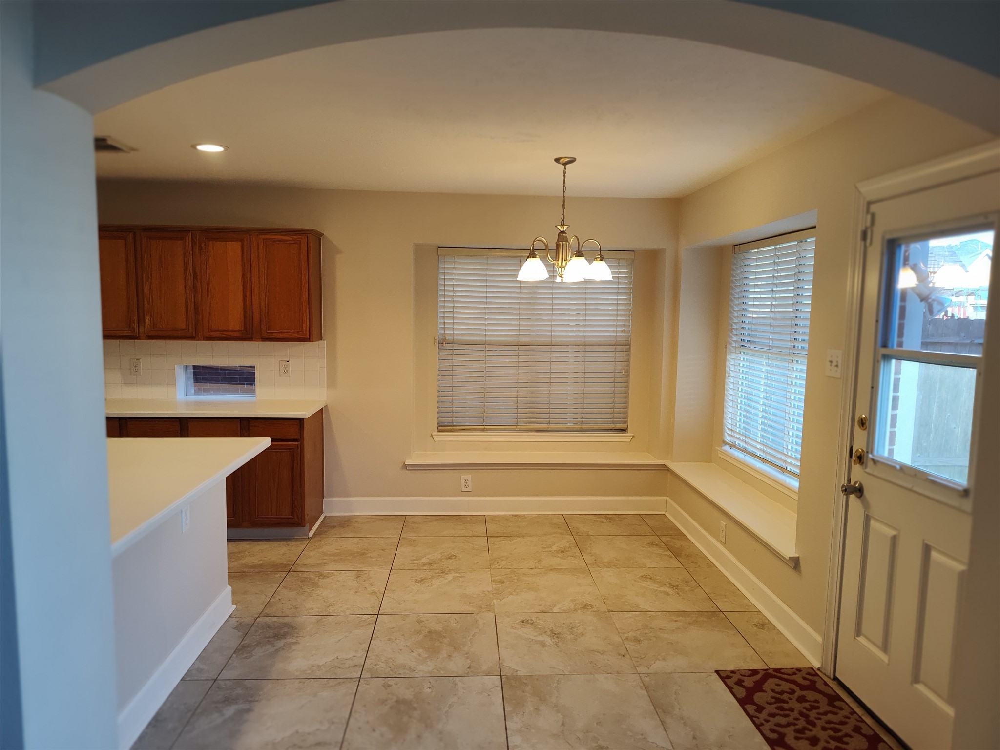 4127 North Nolan Place Pearland, TX 77584 - Photo 6 of 25 a view of an empty room with a fireplace and a window