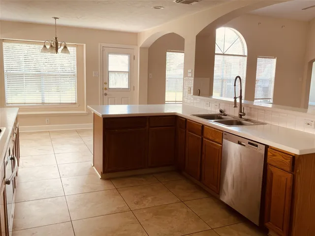 a kitchen with a sink and cabinets