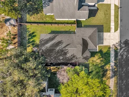 an aerial view of a houses with outdoor space