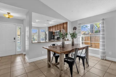a view of a dining room with furniture and window