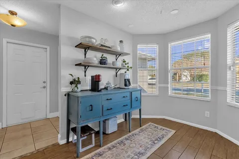 a room with furniture and wooden floor