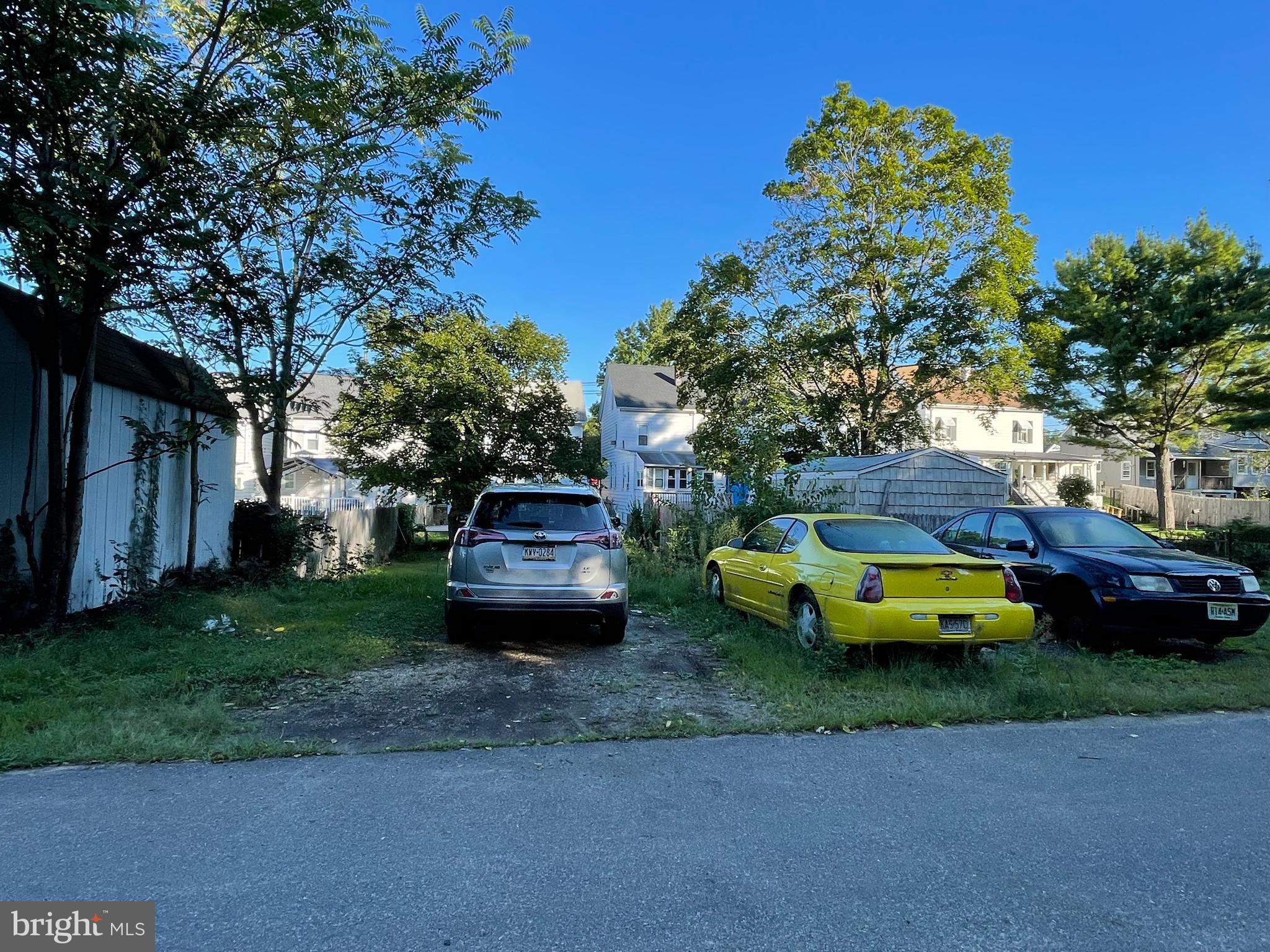 209 Main Street Hamilton, NJ 08620 - Photo 18 of 18 a view of a house with a garden and parking space