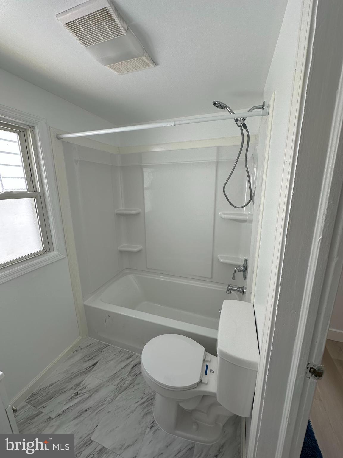 209 Main Street Hamilton, NJ 08620 - Photo 4 of 18 a bathroom with a toilet and a shower