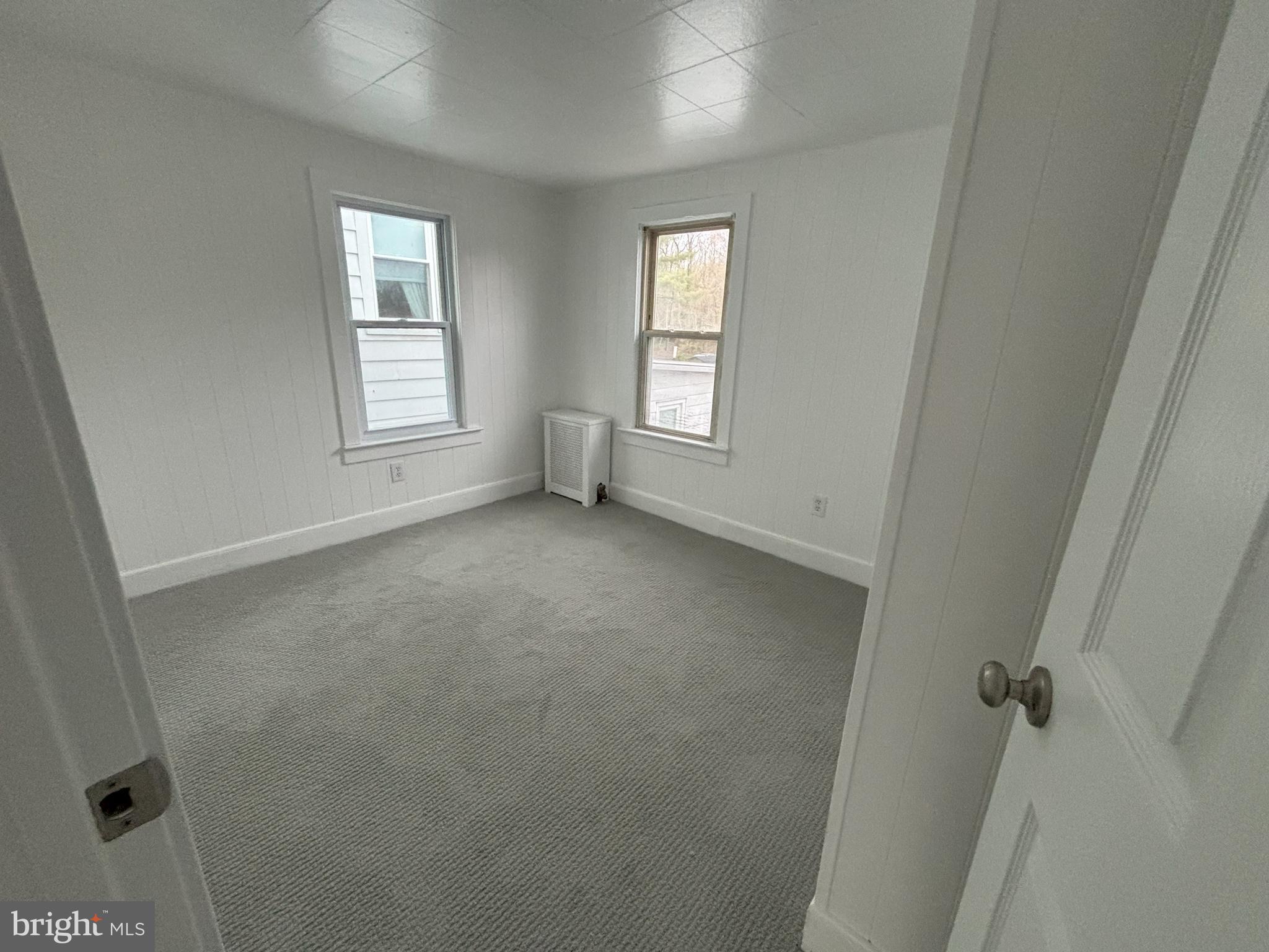 209 Main Street Hamilton, NJ 08620 - Photo 9 of 18 an empty room with windows