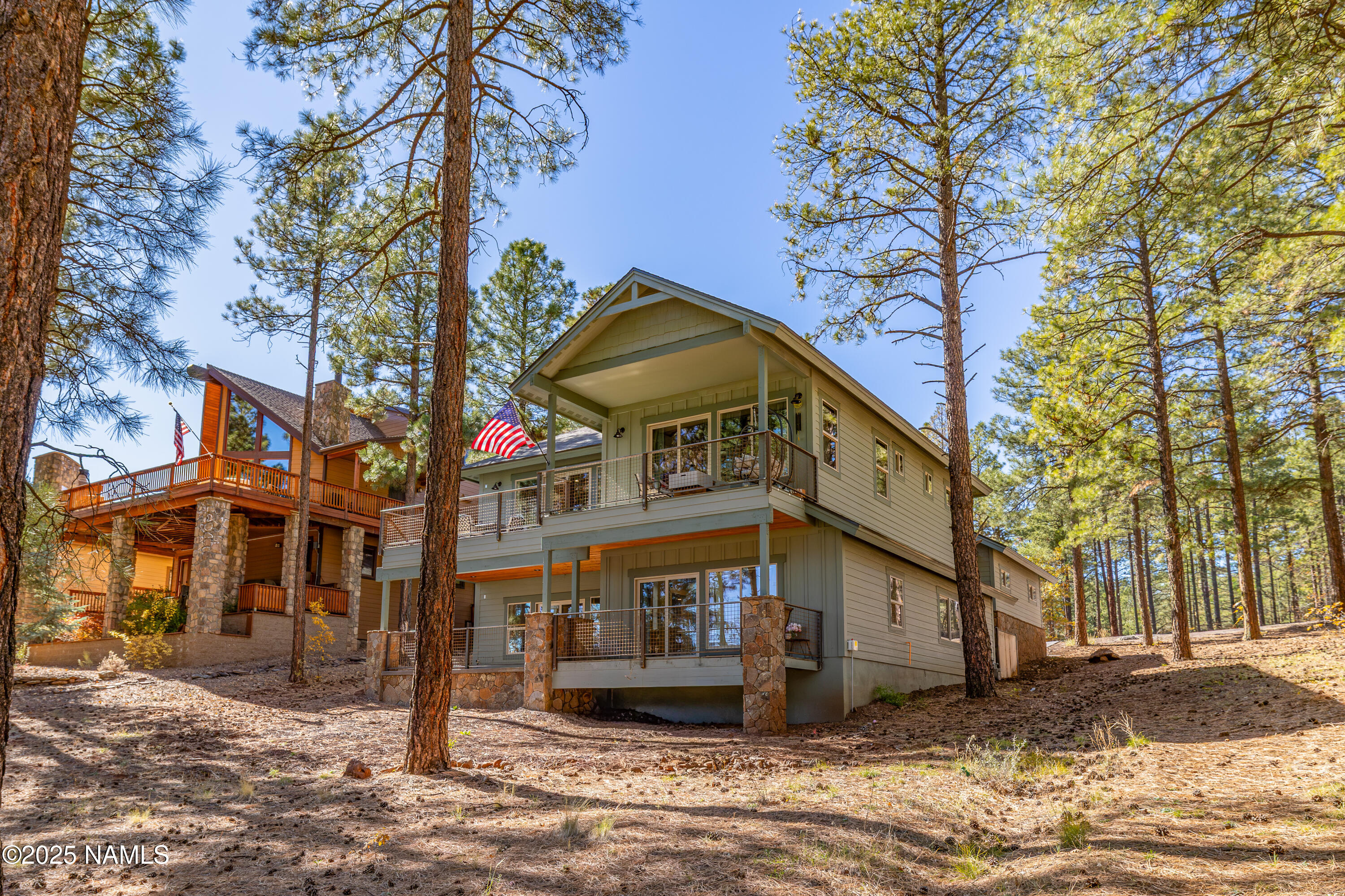 4180 Lariat Loop Flagstaff, AZ 86005 - Photo 22 of 59 a front view of a house with a yard