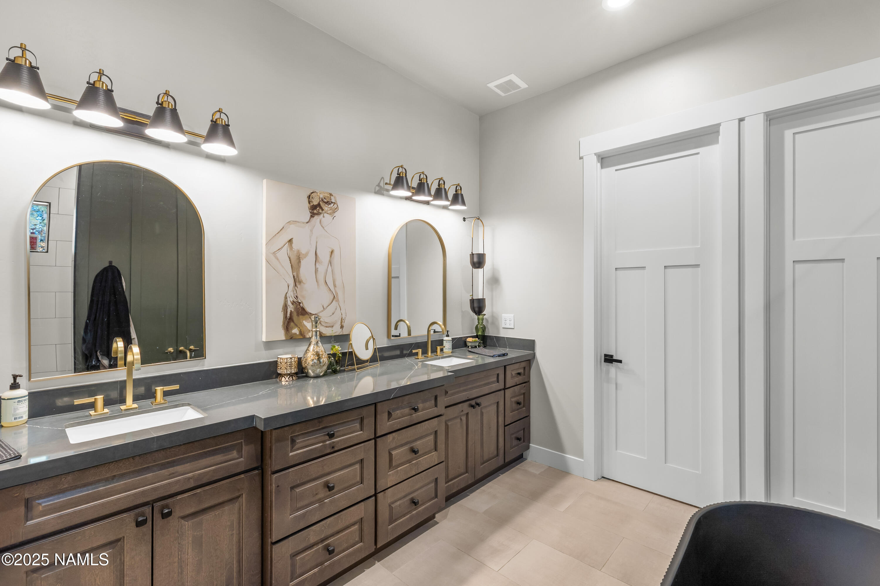4180 Lariat Loop Flagstaff, AZ 86005 - Photo 26 of 59 a en suite bathroom with a double vanity sink and a mirror