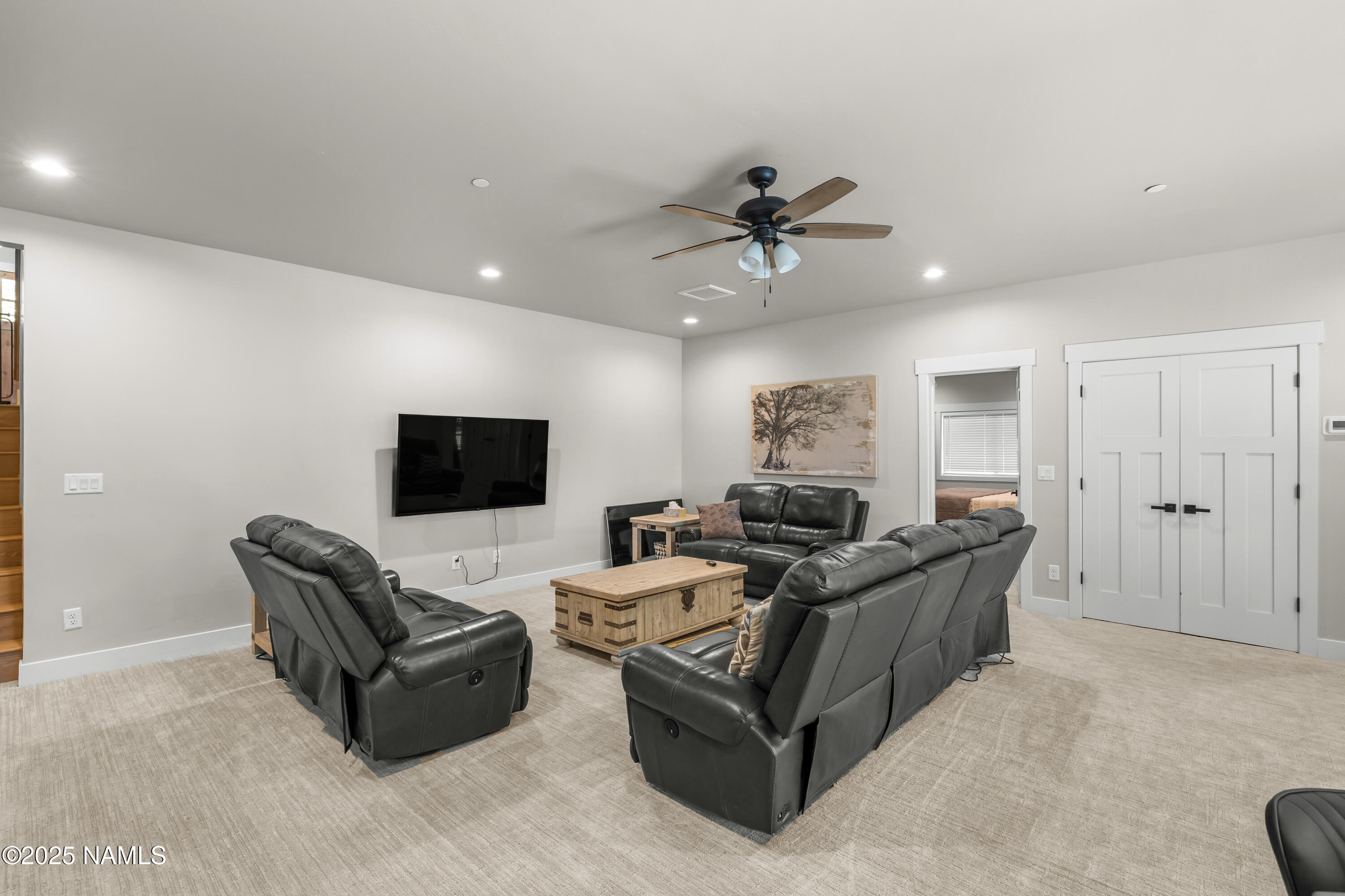 4180 Lariat Loop Flagstaff, AZ 86005 - Photo 31 of 59 a living room with furniture and a flat screen tv