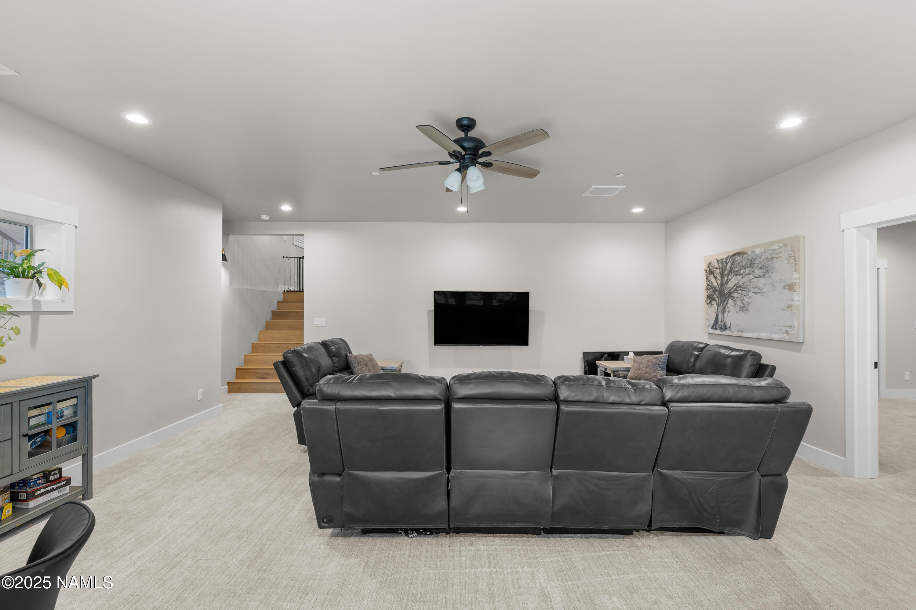 4180 Lariat Loop Flagstaff, AZ 86005 - Photo 32 of 59 a living room with furniture and a flat screen tv