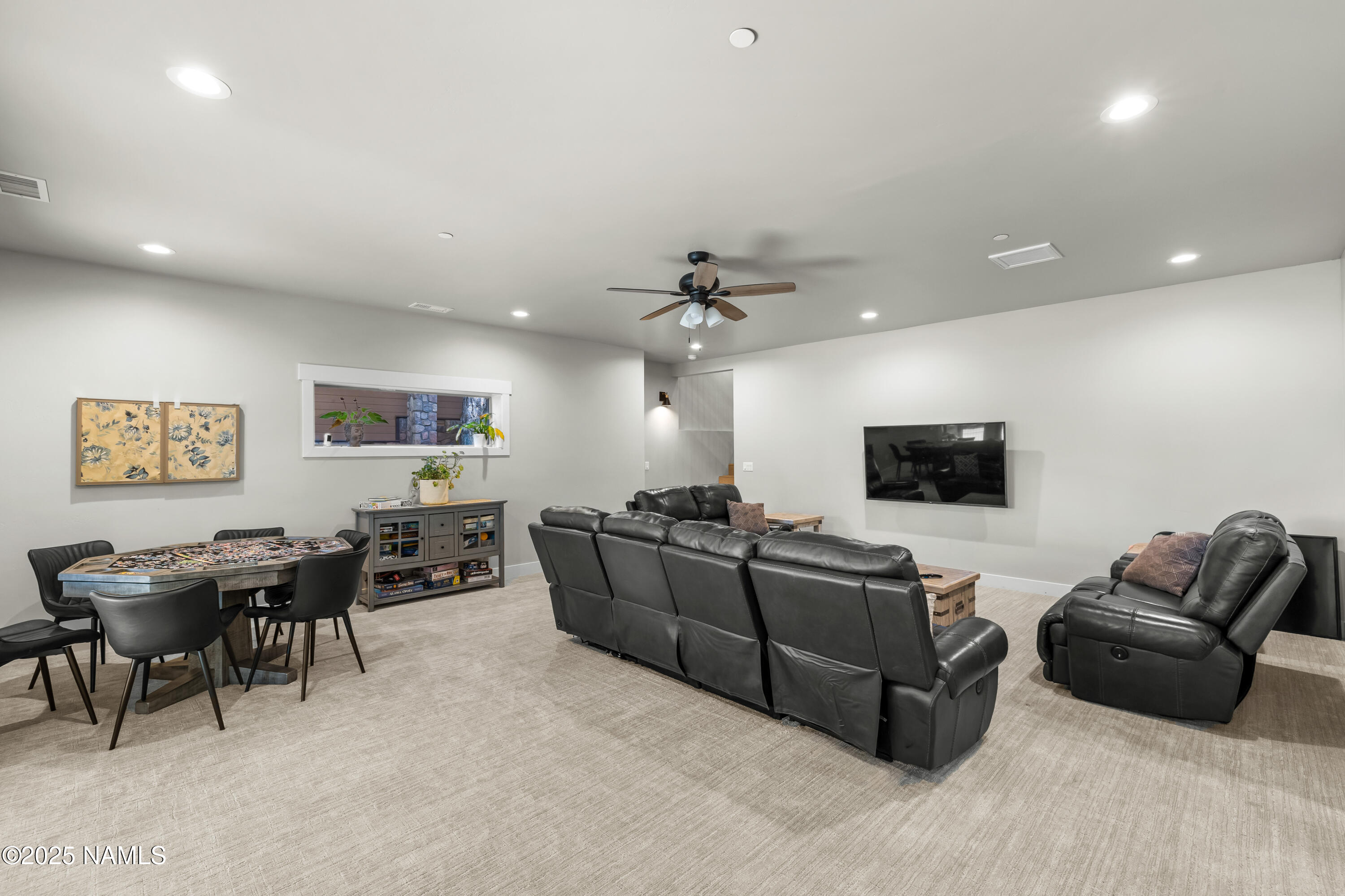 4180 Lariat Loop Flagstaff, AZ 86005 - Photo 33 of 59 a living room with furniture and a flat screen tv