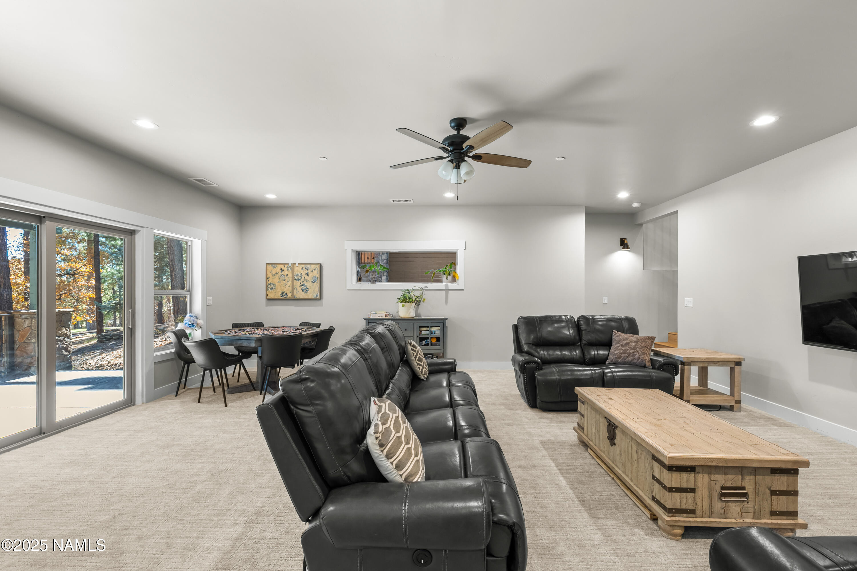 4180 Lariat Loop Flagstaff, AZ 86005 - Photo 34 of 59 a living room with furniture and a flat screen tv