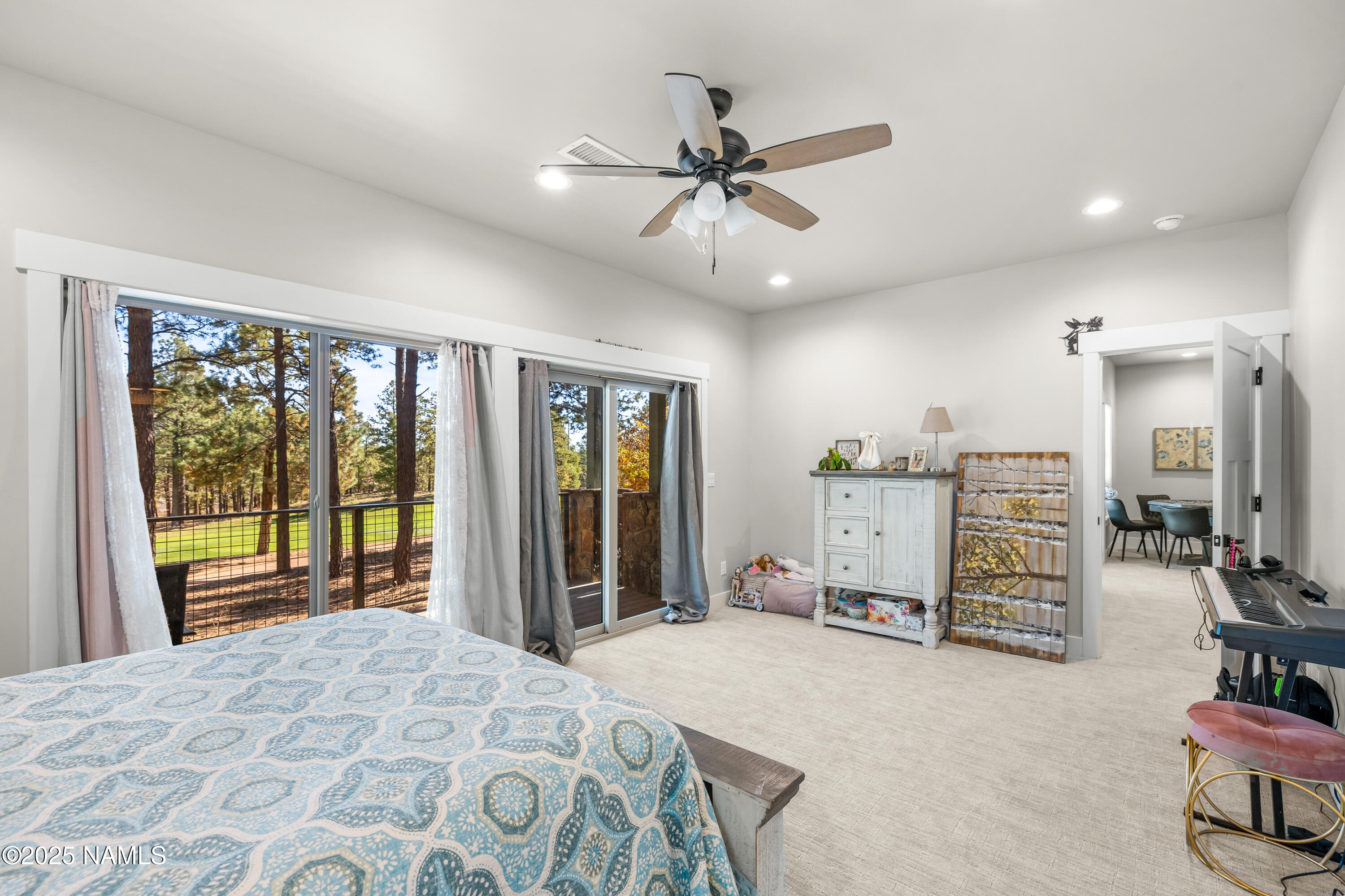 4180 Lariat Loop Flagstaff, AZ 86005 - Photo 37 of 59 a bedroom with furniture and large window