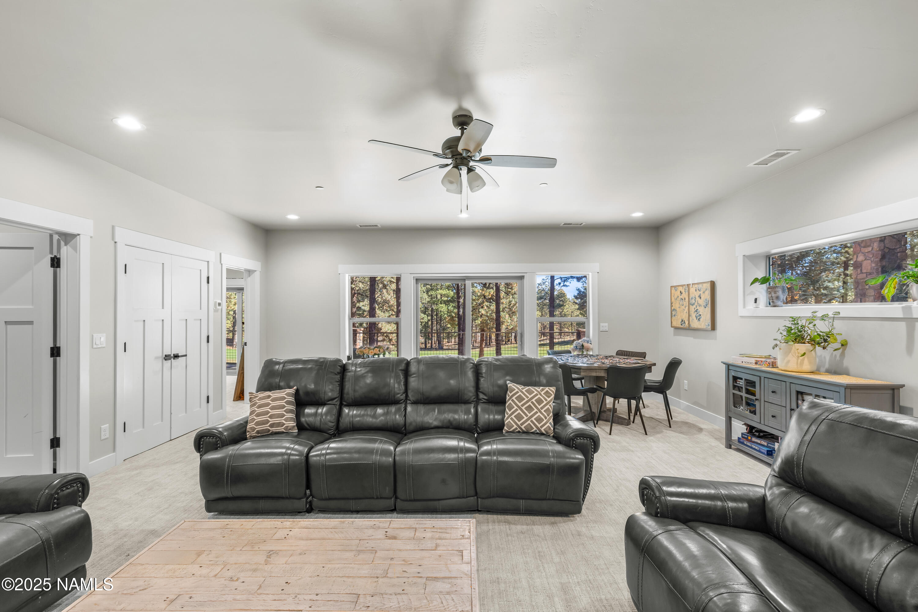 4180 Lariat Loop Flagstaff, AZ 86005 - Photo 39 of 59 a living room with furniture ceiling fan and a window