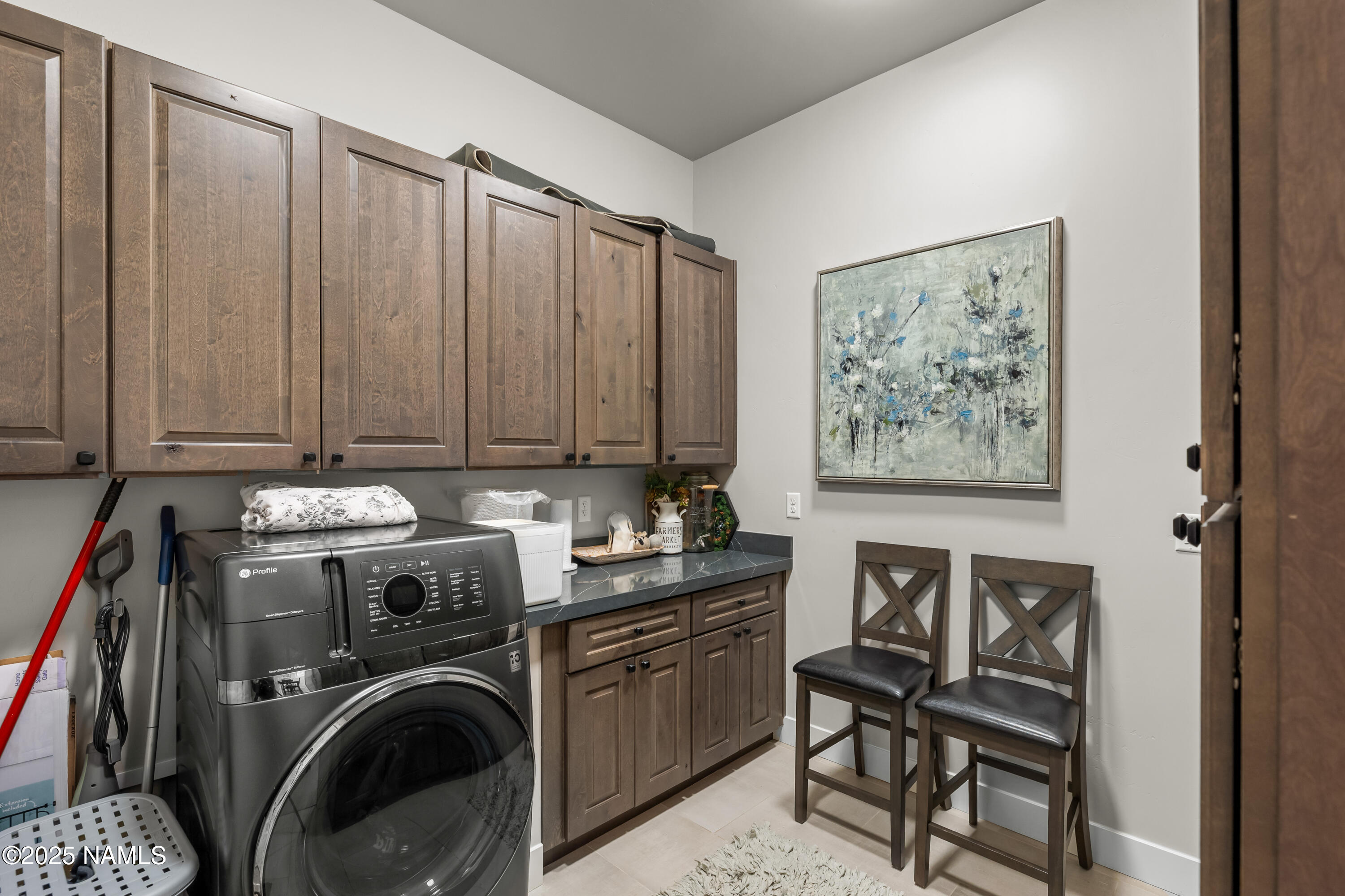 4180 Lariat Loop Flagstaff, AZ 86005 - Photo 44 of 59 a view of a storage and utility room with washer and dryer