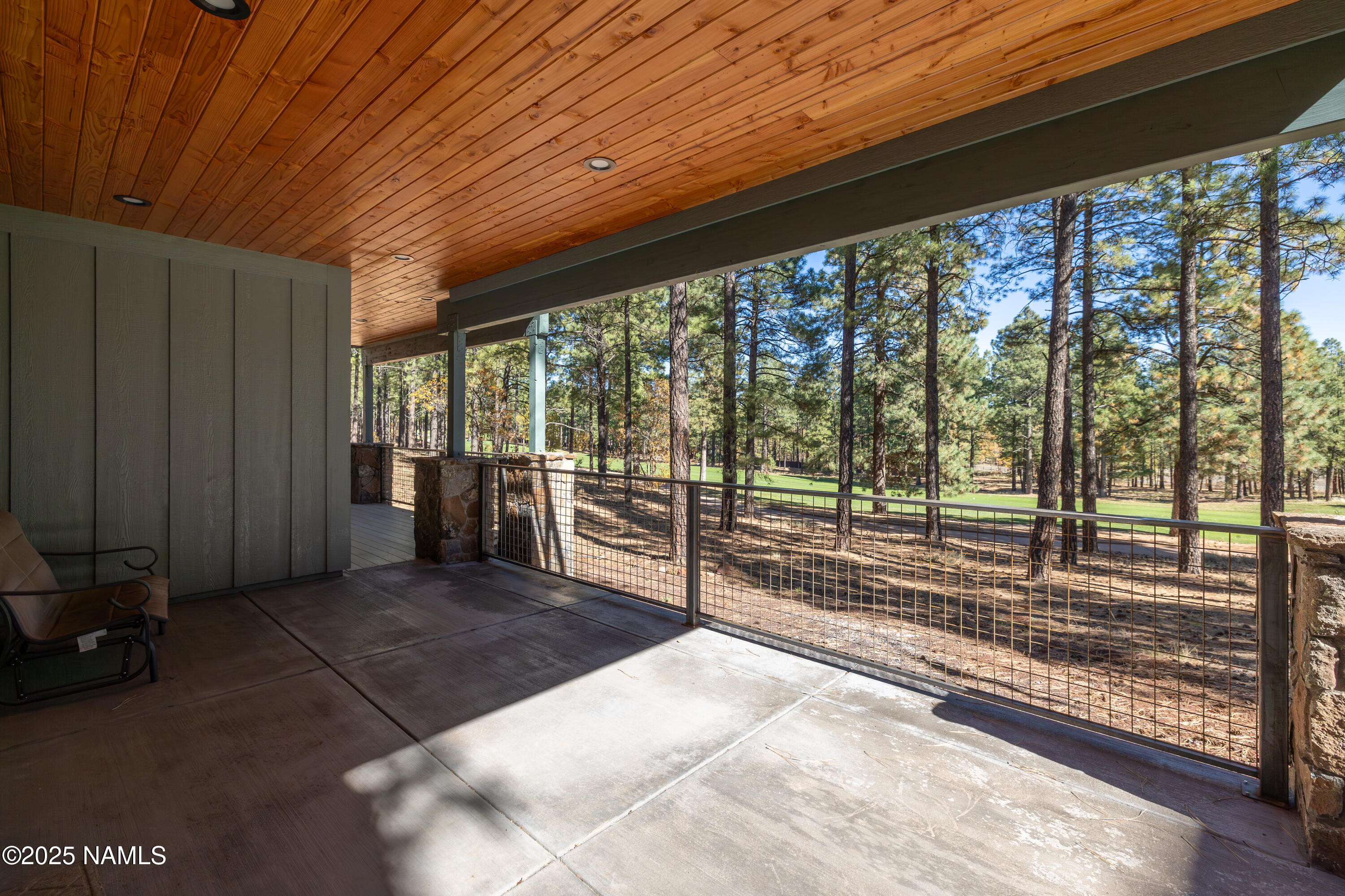 4180 Lariat Loop Flagstaff, AZ 86005 - Photo 52 of 59 a view of a porch with wooden floor and stairs