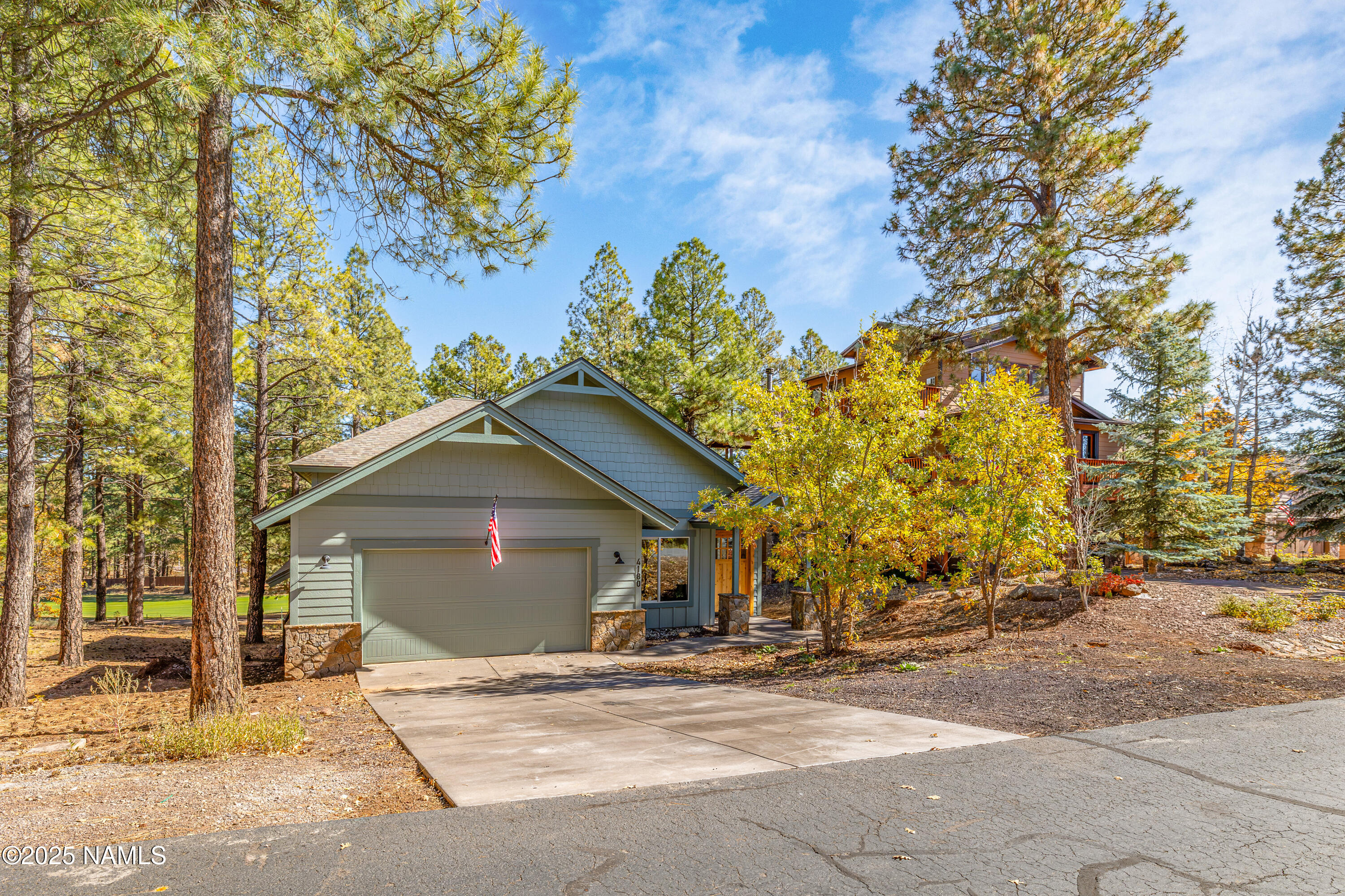 4180 Lariat Loop Flagstaff, AZ 86005 - Photo 58 of 59 a view of a house with a yard and garage