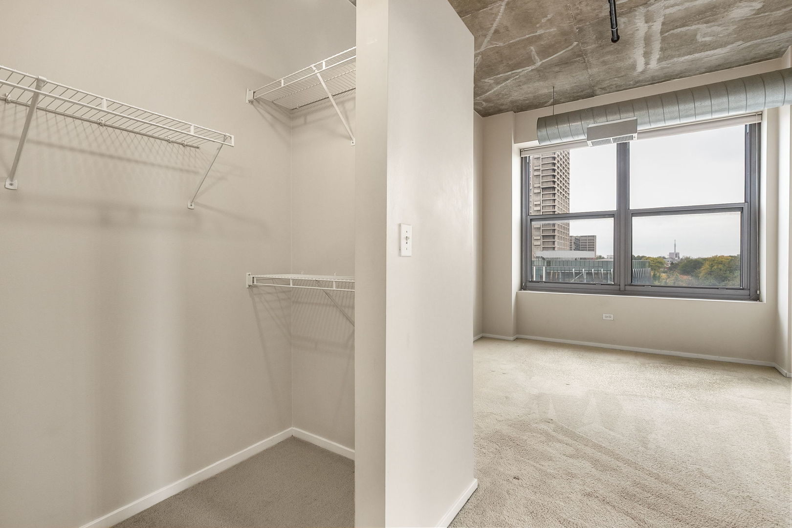 933 West Van Buren Street, Unit 516 Chicago, IL 60607 - Photo 12 of 29 a view of an empty room with a window