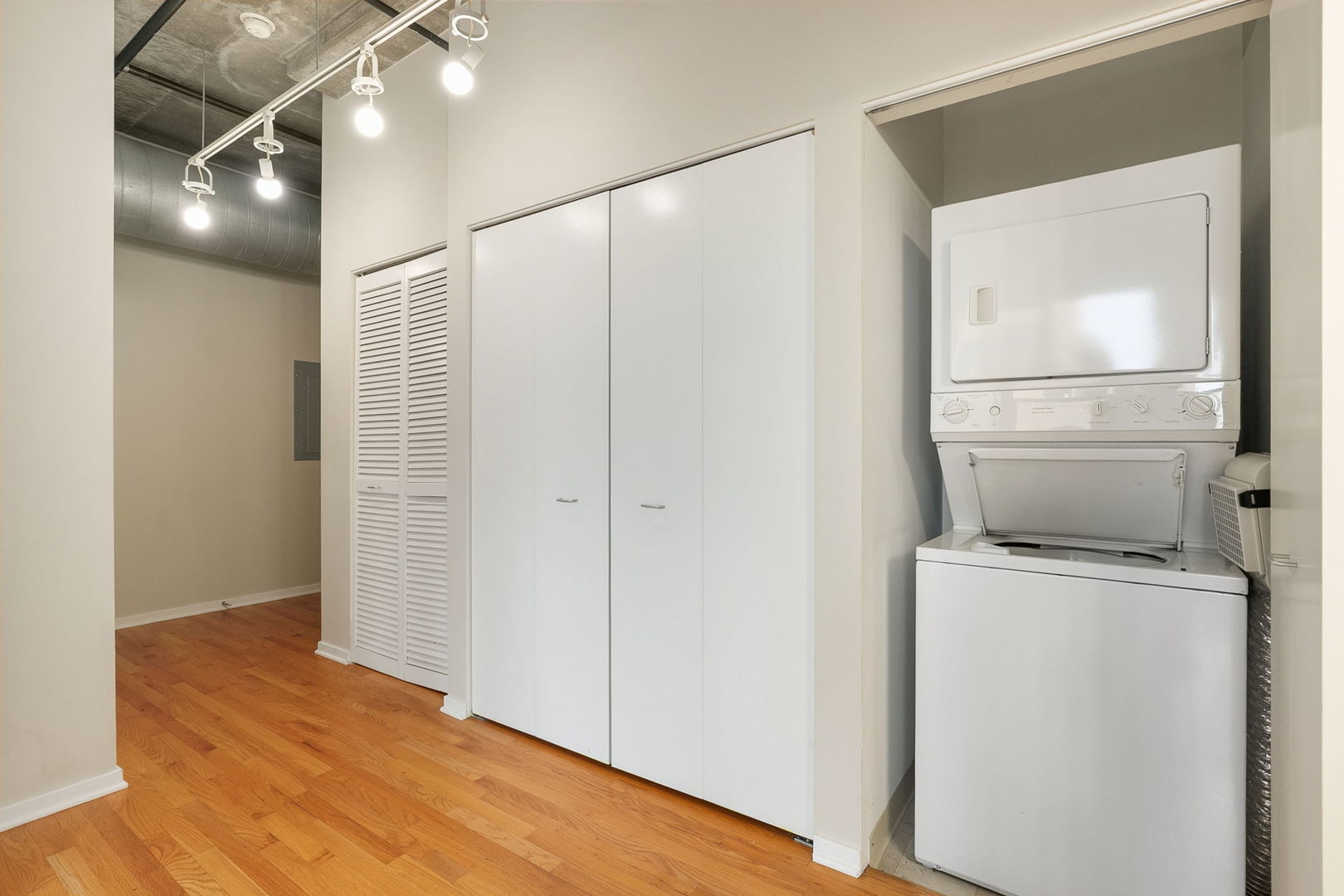 933 West Van Buren Street, Unit 516 Chicago, IL 60607 - Photo 19 of 29 a view of storage and utility room with wooden floor