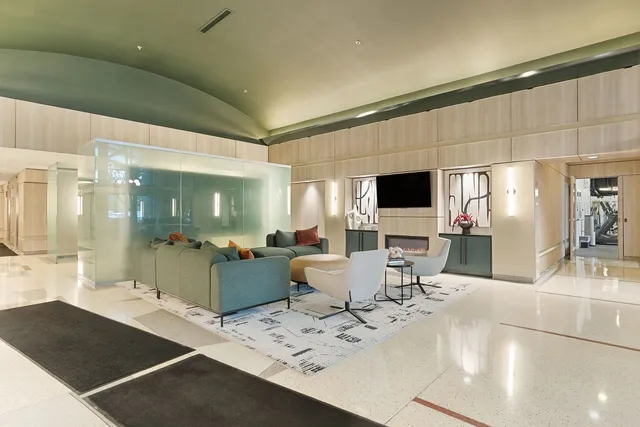 a living room with furniture and flat screen tv