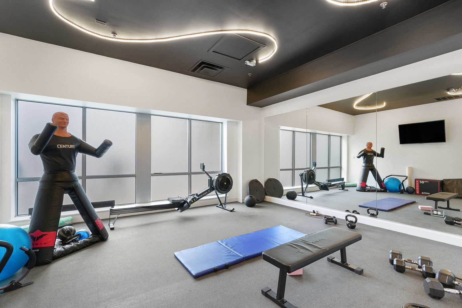 933 West Van Buren Street, Unit 516 Chicago, IL 60607 - Photo 22 of 29 a room with gym equipment and a table