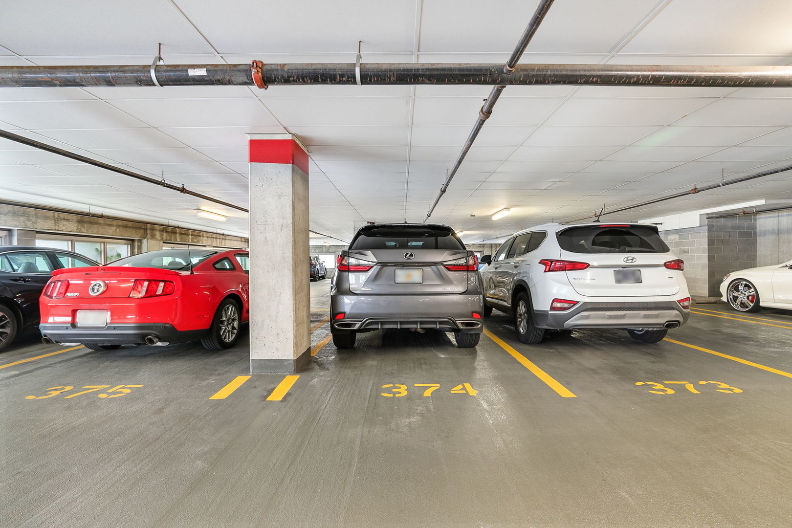 933 West Van Buren Street, Unit 516 Chicago, IL 60607 - Photo 24 of 29 a view of cars parked in a parking
