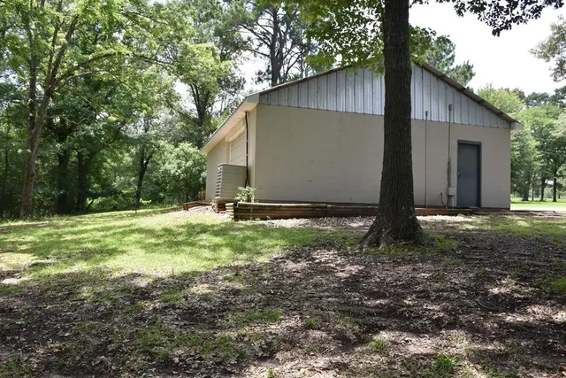 a backyard of a house with lots of green space