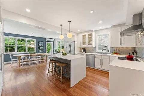 a kitchen with a sink stove and wooden cabinets