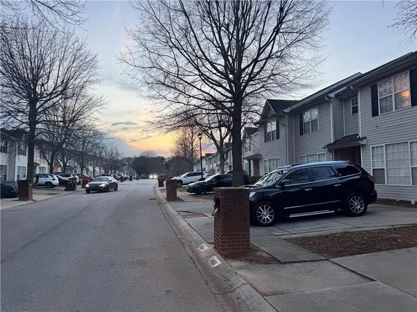 a car parked in front of a brick house