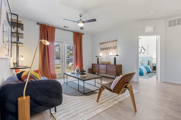 a living room with furniture and a window