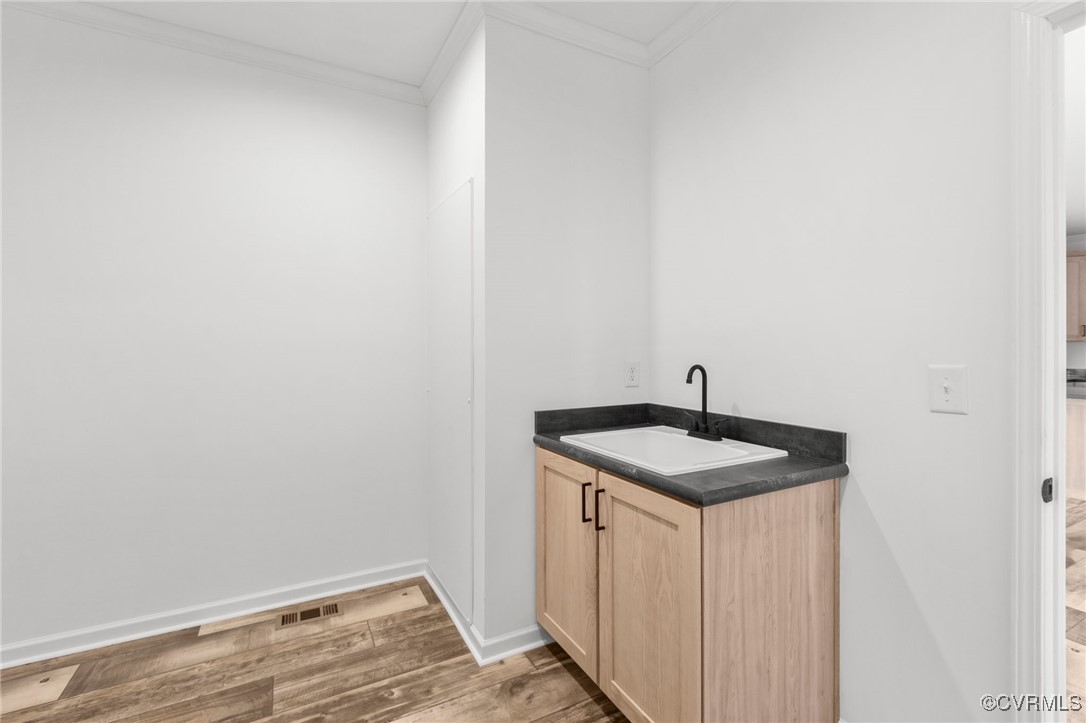 1151 Levi Road Green Bay, VA 23942 - Photo 18 of 38 Bathroom with vanity, crown molding, baseboards, v