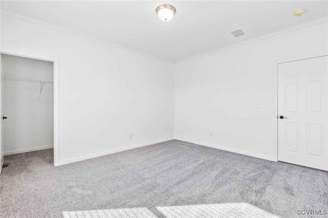 1151 Levi Road Green Bay, VA 23942 - Photo 21 of 38 Unfurnished bedroom featuring a walk in closet, cr