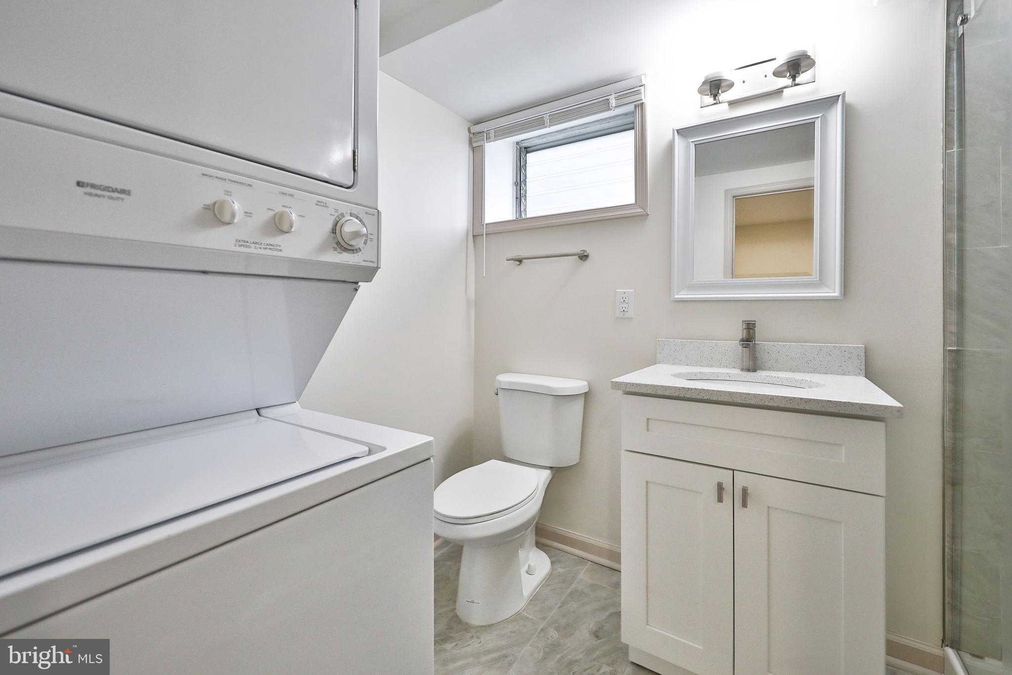 314 Huntingdon Pike, Unit 314A Jenkintown, PA 19046 - Photo 8 of 14 a bathroom with a toilet sink and mirror