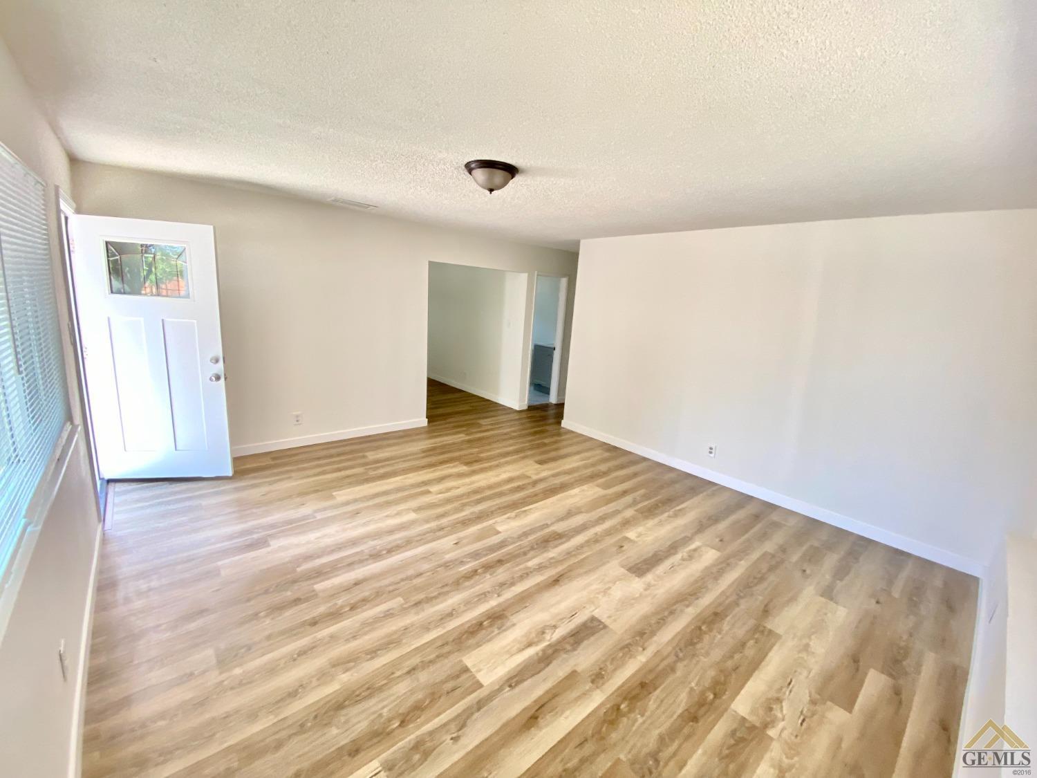 Undisclosed Address Wasco, CA 93280 - Photo 2 of 10 a view of an empty room