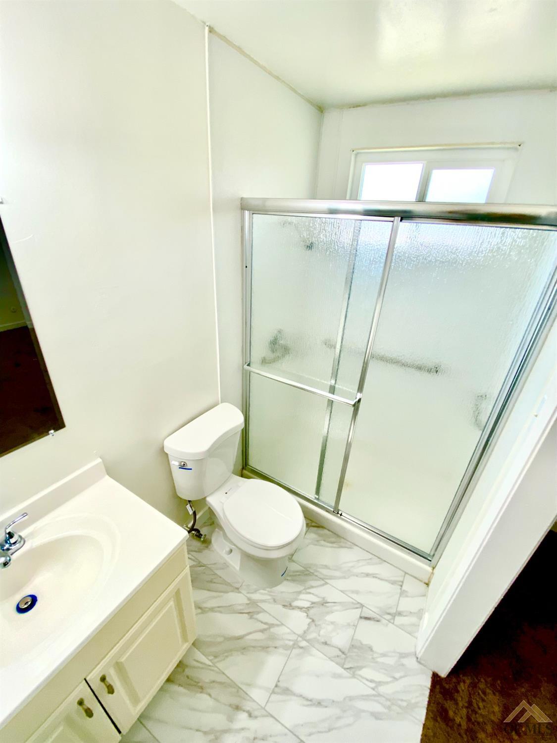 Undisclosed Address Wasco, CA 93280 - Photo 6 of 10 a bathroom with a sink and toilet