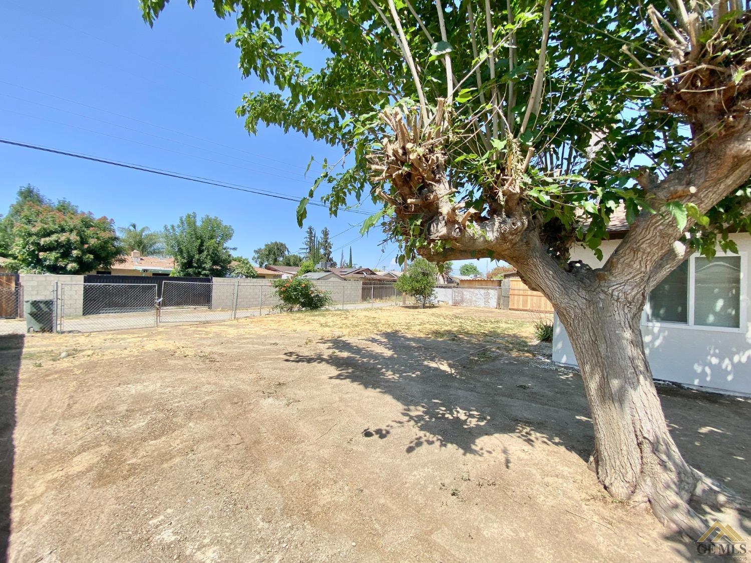 Undisclosed Address Wasco, CA 93280 - Photo 10 of 10 a view of a yard with plants and trees
