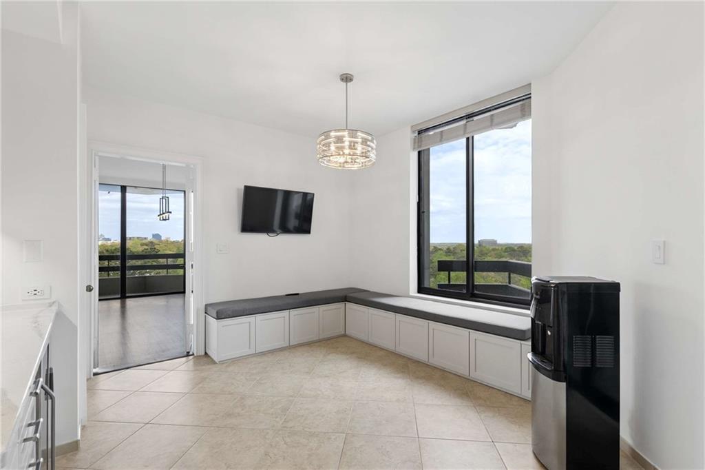 2660 Peachtree Road Northwest, Unit 13F Atlanta, GA 30305 - Photo 19 of 56 a view of a hallway with windows and chandelier