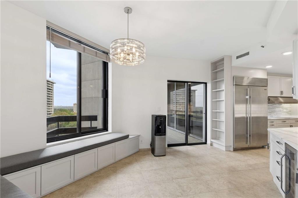 2660 Peachtree Road Northwest, Unit 13F Atlanta, GA 30305 - Photo 20 of 56 a view of a big room with windows chandelier