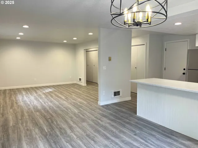a kitchen with a stove and a refrigerator
