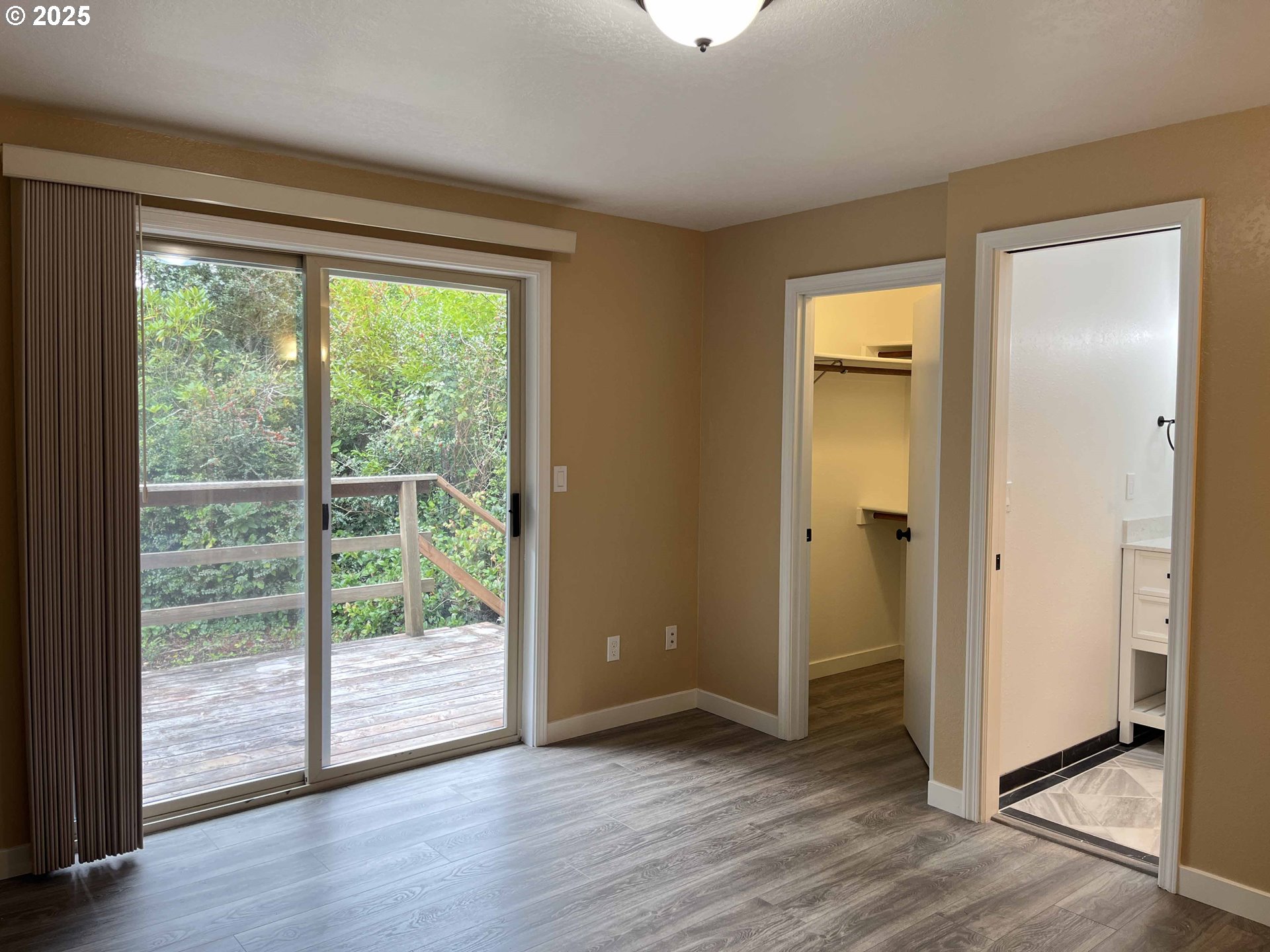 2040 11th Street Florence, OR 97439 - Photo 21 of 43 a view of empty room with wooden floor and fan